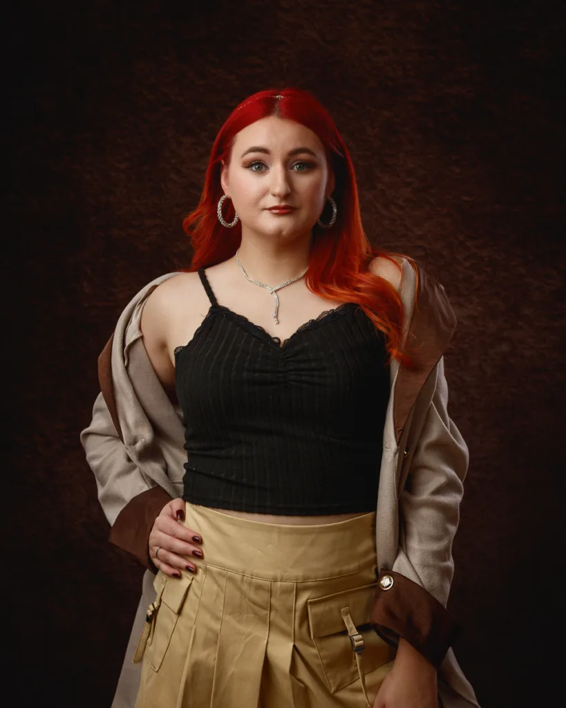 Woman with red hair wearing stylish outfit