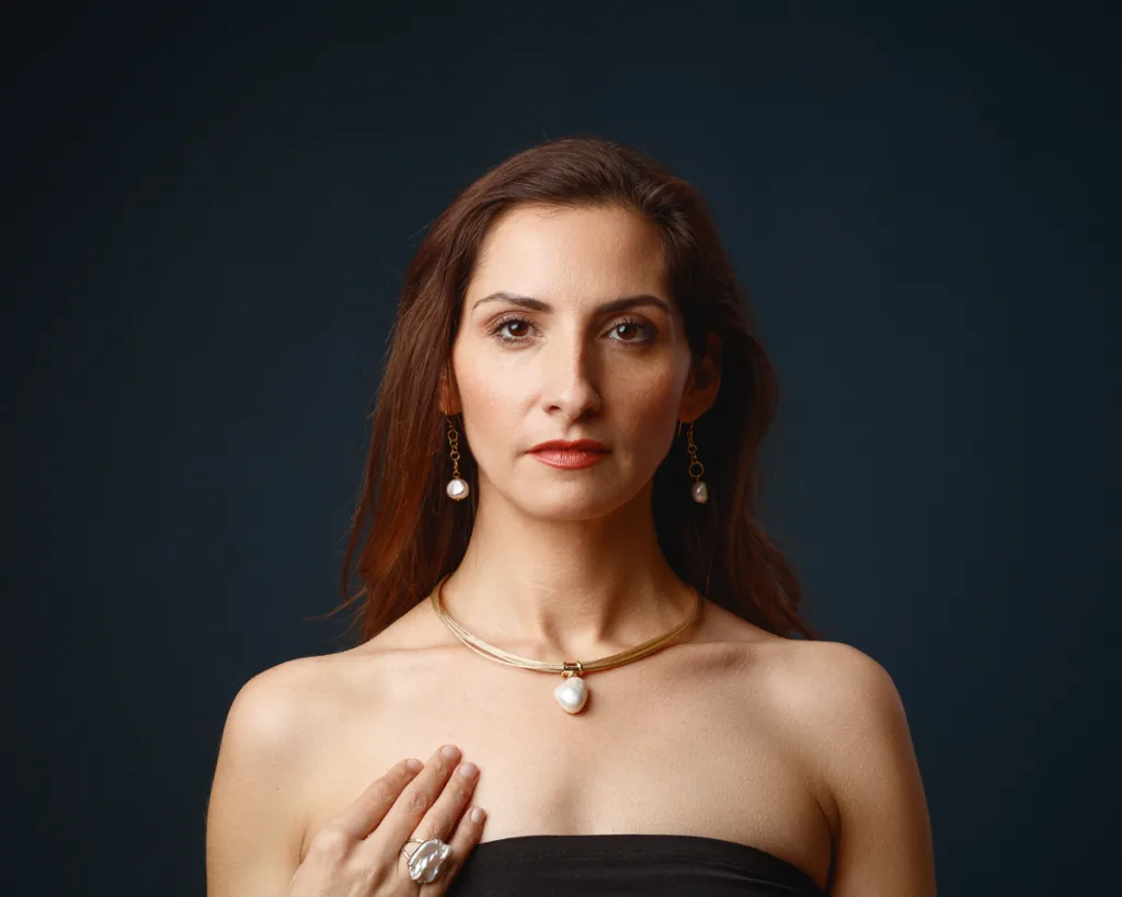 Woman wearing pearl necklace and earrings