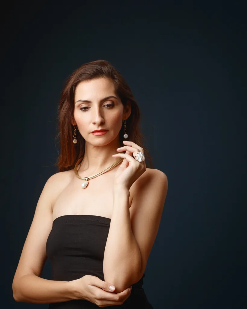 Elegant woman in black dress with jewellery