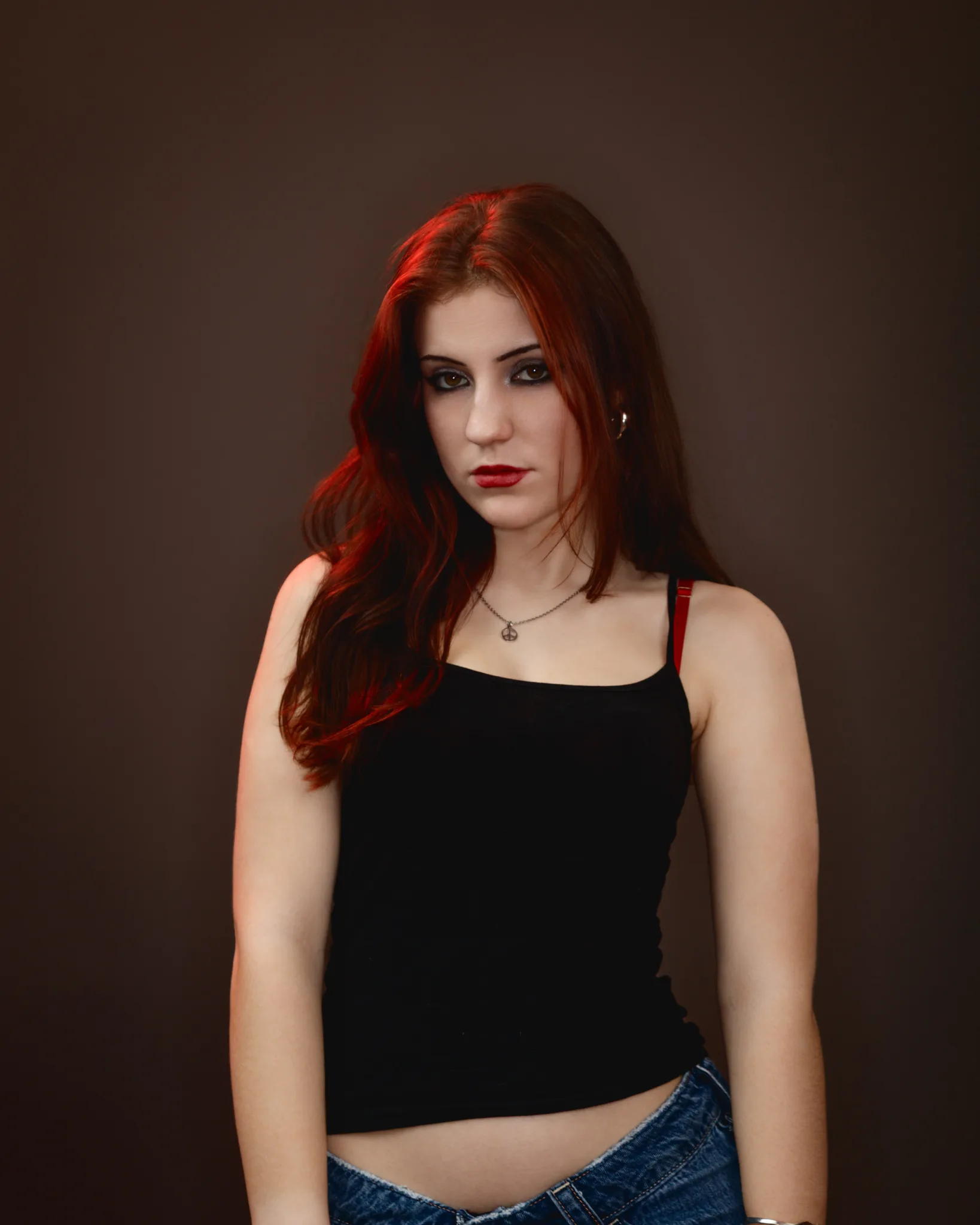 Woman in black top with red hair