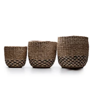 Three woven seagrass storage baskets in increasing sizes