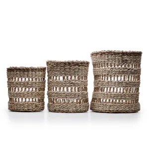 Three woven seagrass storage baskets in increasing sizes