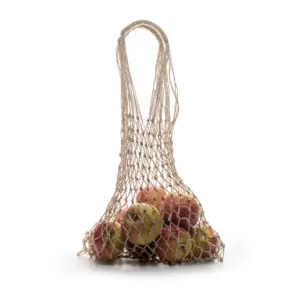 Natural jute string bag holding fresh red apples