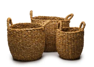 Three woven straw storage baskets with handles