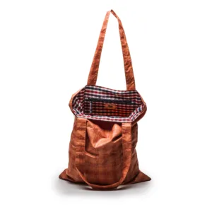 Orange textured shoulder bag with checked lining interior